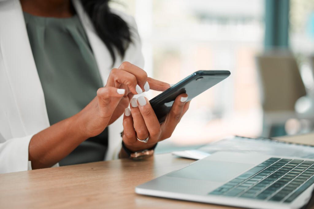 Employee using mobile phone to electronically sign an eForm to process in a workflow